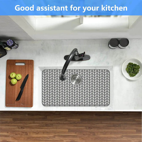 Top view of kitchen sink with Silicone Sink Protector Mat For Kitchen Sinks 12 To 30 Inch Non Slip Raised Feet Gray in place.