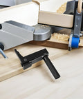 Grab And Go Ready Portable Aluminum Woodworking Clamp on workbench with sawdust and machinery, quick clamping heavy duty vise in use.