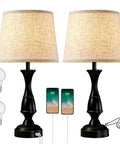 Table Lamps Set Of 2 With Touch Control And USB Ports, black finish, includes bulbs, shown with mobile charging and dimming feature.