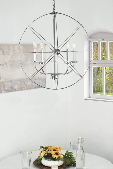 24-Inch Modern Orb Chandelier With Five Lights In Chrome Finish, Intertwining Ring Design For Farmhouse, Mid-Century Modern, And Industrial Vibe Spaces, Big Statement Ceiling Light Fixture hanging above dining table.