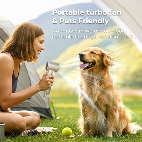 Woman using On The Go Turbo Handheld Fan for Outdoor Adventures with 5000mAh battery to cool a dog at a campsite.