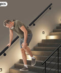 Flush Wall Mounted Stainless Steel Handrail Featuring Heavy Duty Sleek Black Cylinder With Rock Solid Grip And Knockout Antislip Coating Built Tough For Secure Stair Support And Everyday Hallway Use, highlighted in use on stairs.