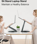 Two women using Telescopic Laptop Stand For Desk With 360 Degree Swivel Base Sit To Stand Height Adjustable Portable Riser Gray.