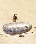 Slick Oval Ceramic Bathroom Sink For Countertop Vanity Rock Solid Above Counter Style With Pop Up Drain No Overflow Easy Setup Knockout Look For Small Half Baths And Daily Home Refreshers, 60x40cm with decorative gold pattern.