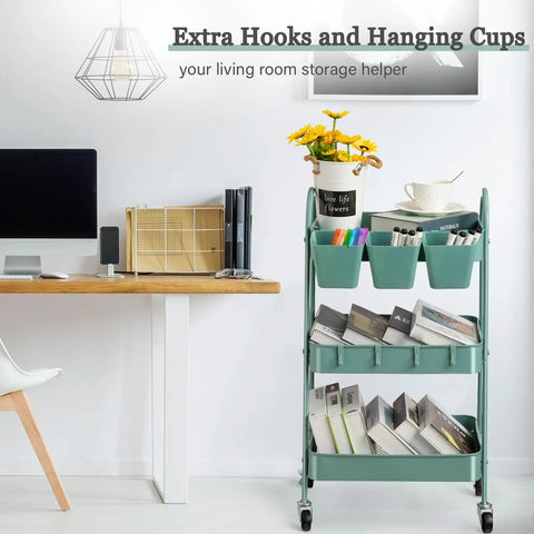 3 Tier Rolling Cart With Lockable Wheels And Hanging Cups, Heavy Duty Metal Utility Cart in green, beside a desk in an office.