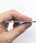Side view of a 3-inch exhaust gasket with graphite seal for a 3-bolt 3-hole collector