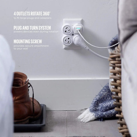 Revolve Basic Four Outlet Rotating Adapter for Wall Outlet with 360 Degree Swivel No Wiring Needed Compact Travel Ready Multi Outlet in White installed in living room.