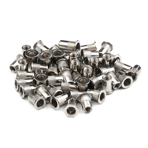 Forty Pack Flat Head Threaded Insert Nuts Made From Stainless Steel For Strong Holds On Metal Sheets Wood And Plastics With Knurled Body That Stops Spinning During Install For Super Durable Fixes - close-up of knurled stainless steel nuts.