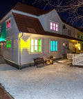 Colorful house exterior lit by RGB LED flood lights for indoor and outdoor decor with remote control waterproof color changing wall washer dimmable security lighting US 3 prong plug 200W 16 color modes and patterns