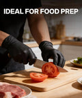 Heavy Duty Nitrile Work Gloves 8 Mil Thick Tough As Nails Textured Grain Grip Powder And Latex Free Job Site Ready Industrial Safety Gloves Black Large 100 Pack worn while slicing tomatoes in a kitchen.