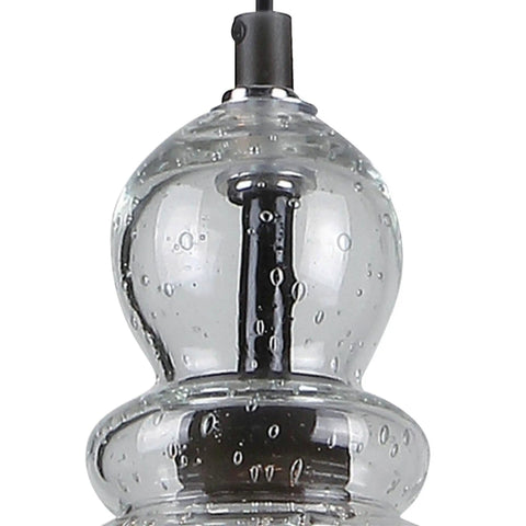 Close-up of hand blown clear seeded glass on Two Pack One Light Adjustable Mini Pendant With Hand Blown Clear Seeded Glass In Oil Rubbed Bronze Finish, Sloped Ceiling Compatible, Includes Mounting Hardware And A 50 Inch Cord For That Retro Vibe