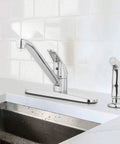 Premium Single Handle High Arc Kitchen Faucet With Swivel Side Spray, Polished Chrome Finish, side view in kitchen sink setting.