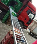 Industrial Workhorse Light Duty Gravity Roller Conveyor Slide Smooth Warehouse Freight Operator No Fuss Steel Roller Track For Factory Hauling 40X100CM in use while loading boxes onto a truck.