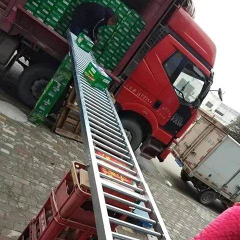 Industrial Workhorse Light Duty Gravity Roller Conveyor Slide Smooth Warehouse Freight Operator No Fuss Steel Roller Track For Factory Hauling 40X100CM in use while loading boxes onto a truck.