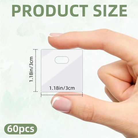 Hand holding a transparent PVC tab from 60 Piece Vertical Blind Repair Tabs Kit With Transparent PVC Adhesive Fixers For Replacement Slats Invisible Snap In Patches Easy DIY Fix No Tools Needed, showing size 1.18in x 1.18in.