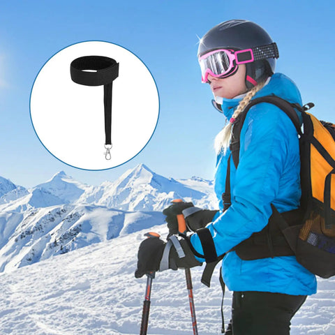 Winter Ski Gloves With Elastic Wrist Straps And Safety Straps For Snowboarding And Mountaineering Includes Keychains Durable Outdoor Gear For Men Built For Tough Conditions, shown on a skier with black straps visible.