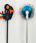 Clamp and mop hanging from 2 Pack Heavy Duty Magnetic Garage Hooks With Rubber Coated Magnets, No Drill Wall Hangers