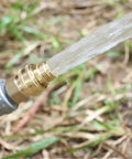 Three Quarter Inch Full Flow Brass Garden Hose Quick Connect Fittings Set No Fuss With Lead Free Full Port Design And High Volume Quick Release Coupler For Five Eighth And Three Quarter Inch Hoses in use, showing water flow
