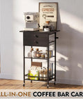 Slick Black Five Tier Coffee Cart Compact Game Changer Bar Station For Tiny Kitchens with espresso machine and storage.