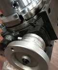 Precision Tilting Rotary Table With Three Jaw Chuck And Six Inch Centering Adapter, showing angle dial and heavy base.