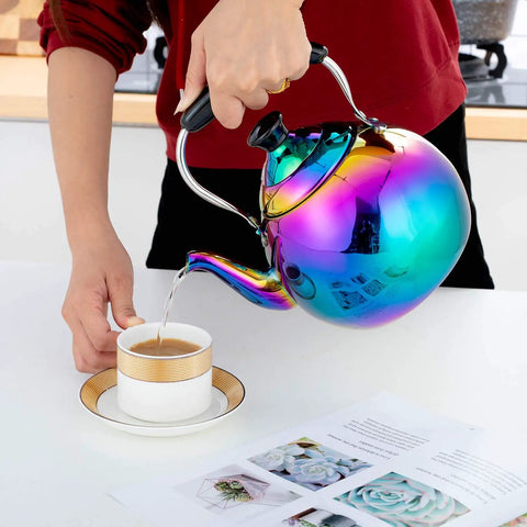 Induction Compatible Stovetop Tea Kettle Stainless Steel Whistling Tea Kettle Rainbow Iridescent Mirror Finish 2 Quart For Gas Stove Top Fast Boiling Water Modern Colorful Teakettle pouring tea