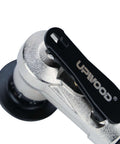 Air chamfer tool close-up; metal body with black lever handle, compact pneumatic deburring device.