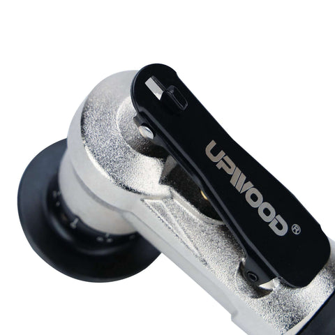 Air chamfer tool close-up; metal body with black lever handle, compact pneumatic deburring device.