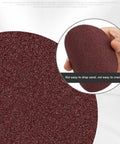 Close-up of a 4 inch silicone carbide sanding disc from the Ultimate 100 Pack Of 4 Inch Hook And Loop Sanding Discs With 15 Grits From Coarse To Ultra Fine.