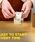Hands using Smooth Operator Clear Shipping Packing Tape With Heavy Duty Dispenser for easy box sealing.
