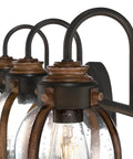 Close-up of Vintage Style Three Light Indoor Vanity Light Fixture In Oil Rubbed Bronze With Barnwood Accents And Hand Blown Clear Seeded Glass