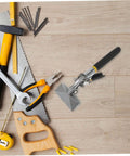 Manual Metal Bender With Straight Jaw Hand Seamer for sheet metal, surrounded by various tools on a wooden surface