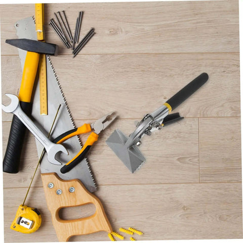Manual Metal Bender With Straight Jaw Hand Seamer for sheet metal, surrounded by various tools on a wooden surface