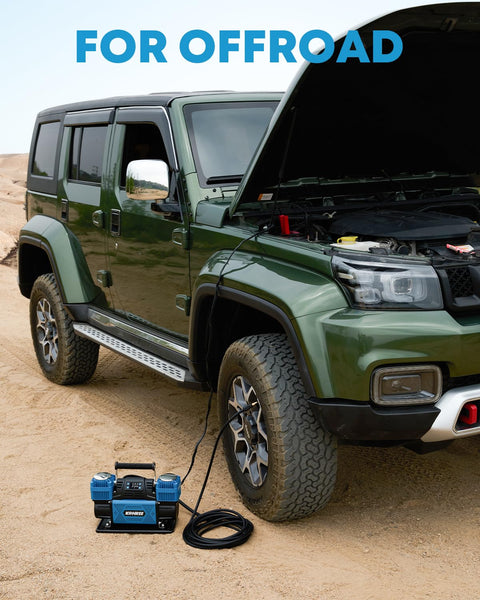 12V Dual Cylinder Air Compressor With Digital Display Panel And Auto Stop Inflation next to SUV on sandy terrain