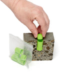 Concrete Moisture Test Starter Kit With L6 Smart Sensors And Fahrenheit Reader ASTM F2170 Compliant, Ideal For Contractors And Flooring Pros, Includes 5 L6 Sensors, 2 Smart Logger V2 Humidity And Temperature Recorders, Drill Bit, Insertion Tool, Case, hand placing green sensor in concrete block
