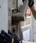 Person operating a high-voltage switch wearing General Utility Work Gloves GUG All Purpose Performance Fit Durable Machine Washable Small Black.