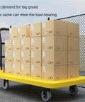 Rugged Heavy Duty Platform Cart Dolly With Thick Steel Flatbed Foldable Handrail 5 Inch TPR Wheels 360 Degree Swivel Rear Wheel, loaded with boxes
