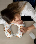 Woman resting on Cute Highland Cow Memory Foam Travel Pillow For Neck Support U Shaped Travel Cushion For Airplane Car And Office
