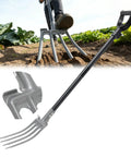 Beast 4 Tine Garden Fork With Heavy Duty 47 Inch Handle being used for soil loosening in a farm garden