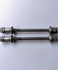 Two steel 190mm bike rear hub axles for multi-speed bicycles; three-eighth inch diameter, 26 TPI threads, with lock nut washer set.
