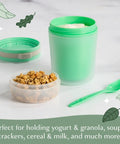 Double Wall Insulated Yogurt Container With Spill Proof For Real Lid Green Snack Cup holding yogurt with granola beside a spoon.