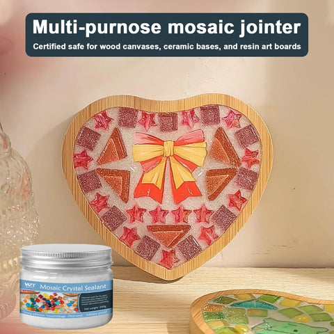 Heart-shaped mosaic artwork made with quick-dry grout, featuring red stars and orange bow. White Crystal Mosaic Grout For Crafts Kit in view.