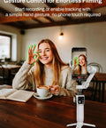 Woman using gesture control with 3 Axis Smartphone Gimbal Stabilizer For iPhone And Android With Bluetooth Remote Control
