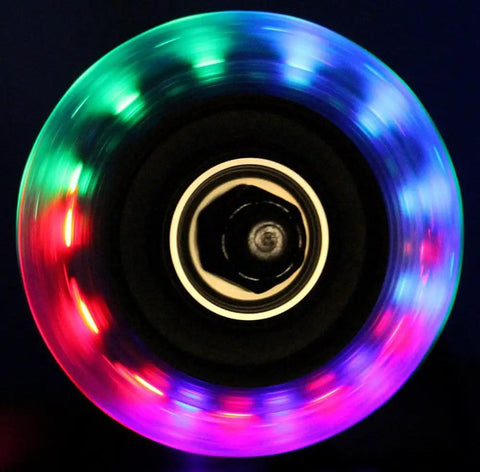 Close-up of 64mm Light Up Inline Skate Wheel with ABEC 9 bearings, 82A durometer, showcasing multicolor LED glow