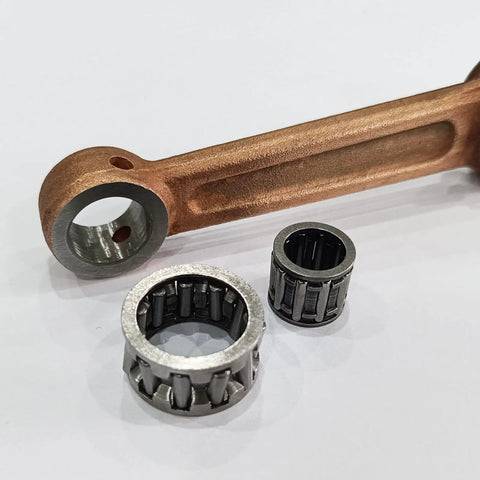 YD100 Connecting Rod With Needle Bearing Set for 2 Stroke Gas Motorized Bicycle, showing silver bearings and copper rod.