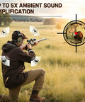Hunter wearing Electronic Ear Protection for Shooting with 5X Sound Amplification and Active Hearing Protection, aiming in field.