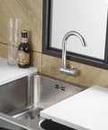 Premium RV Sink Faucet with Spotless Chrome Finish Heavy Duty 360 Swivel Marine Cold Water Tap Compact Deck Mount Setup for Camper Van Yacht and Weekend Road Trips over stainless steel sink.