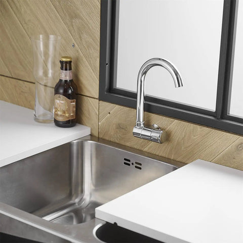 Premium RV Sink Faucet with Spotless Chrome Finish Heavy Duty 360 Swivel Marine Cold Water Tap Compact Deck Mount Setup for Camper Van Yacht and Weekend Road Trips over stainless steel sink.