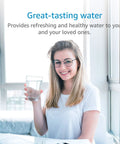 Smiling woman holding a glass of water using Replacement Faucet Water Filter For Aquasana AQ-4035 Systems in bright room