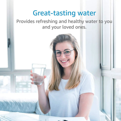 Smiling woman holding a glass of water using Replacement Faucet Water Filter For Aquasana AQ-4035 Systems in bright room