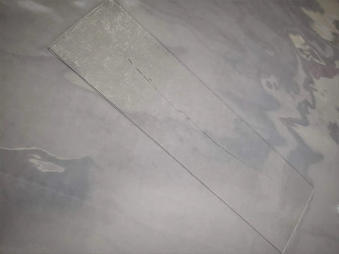 Clear 2 Inch By 24 Inch Universal Adhesive Window Film For Convertible Tops With Glossy Finish, transparent film visible.